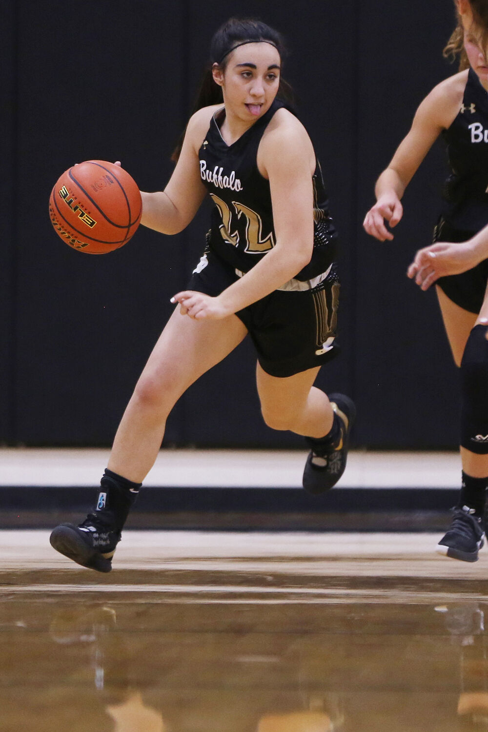 Cantrell Rosalez dribbles down court during the first quarter